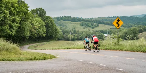Lynchburg Loop Two bike riders starting down a hill in the beautiful country side of Lynchburg, Tennessee.